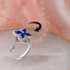 Blue Cubic Zirconia Flower Spinner Ring β Adjustable Silver-Tone Statement Ring for Women