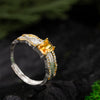 Citrine gemstone ring in sterling silver with 18K gold details and sparkle side stones