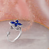 Blue Cubic Zirconia Flower Spinner Ring β Adjustable Silver-Tone Statement Ring for Women