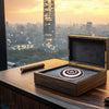Luxury silver pendant presented in elegant wooden gift box – city skyline background