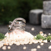 Twisted sterling silver ring with detailed serpent texture, artistic nature-themed composition