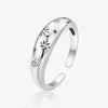 High-polished starry silver ring with open band, displayed on white background