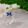 Blue Cubic Zirconia Flower Spinner Ring β Adjustable Silver-Tone Statement Ring for Women