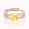 Gold-accented gemstone ring on neutral studio background