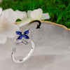 Blue Cubic Zirconia Flower Spinner Ring β Adjustable Silver-Tone Statement Ring for Women