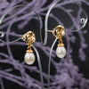 Baroque pearl earrings with gold flower design, delicate handmade accessory
