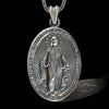 This stunning Handmade Miraculous Medal Necklace features the iconic image of the Virgin Mary. The pendant is made of 925 sterling silver, ensuring both durability and elegance. The intricate detailing on this side showcases the powerful inscription in French, "O MARIE CONÇUE SANS PÉCHÉ PRIEZ POUR NOUS QUI AVONS RECOURS À VOUS," making this a meaningful piece for any Catholic jewelry collection. The fine craftsmanship highlights the attention to detail and uniqueness of this religious item. Perfect as a gif