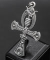 This shot features the Ankh pendant against a floral background, providing contrast that enhances the pendant's intricate details. The 925 sterling silver's polished yet oxidized look gives the pendant a timeless aesthetic, making it suitable for everyday wear or as a thoughtful gift for those interested in spirituality and ancient symbols.