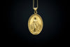 This detailed image showcases the elegant craftsmanship of the Gold-Plated Miraculous Medal Pendant. The intricate design is meticulously handcrafted from 925 sterling silver and enhanced with a luxurious gold plating, giving the piece a timeless and spiritual appearance. The fine detailing of the Virgin Mary and the inscription adds a deep sense of reverence to the pendant. This unique religious piece is perfect for those seeking a meaningful symbol of faith. Its handmade design ensures each pendant is dis