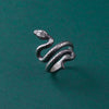 This handmade serpent ring is a true symbol of gothic elegance. Crafted from 925 sterling silver, its intricate design wraps around the finger, creating a powerful statement piece. The adjustable band makes it a versatile and timeless addition to any jewelry collection.