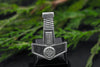 Straight view of handcrafted silver hammer pendant with engraved knotwork and Celtic circle.