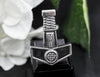 Close-up of Mjolnir pendant with runic symbols, displayed on black jewelry stand.