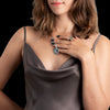 Silver wolf moon pendant on womanβs neck, handcrafted jewelry symbolizing unity and strength