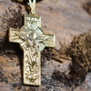 Antique finish 24K gold Christian cross for men and women with sacred detailing on rocky surface