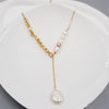 Natural baroque pearl necklace with asymmetrical gold chain and long pendant – chic gift for women