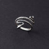 Styled on a hand, this image shows how effortlessly the ring fits and complements any look. Whether you’re going for a casual day out or a formal event, this dainty snake ring adds a touch of charm. The lightweight, comfortable design ensures it can be worn throughout the day with ease, making it a must-have addition to any jewelry collection.