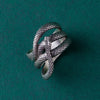 Captured on a model’s hand, this photo illustrates the ring’s snug and comfortable fit, perfectly accentuating any finger. With its unisex design and subtle vintage aesthetic, the ring is versatile for everyday wear or special occasions. It complements a variety of personal styles, from bohemian to gothic, making it a universally appealing accessory.