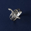 This image shows the ring on a hand, providing an idea of its fit and style in real life. Lightweight at only 5 grams, this gothic snake ring comfortably wraps around the finger without being bulky, making it ideal for daily wear or special occasions. It’s a unique accent piece that complements any gothic or vintage-inspired outfit.