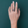 Worn by a man, this image highlights the ring’s bold, rugged aesthetic. The adjustable fit and oxidized silver make it a striking choice for those who appreciate gothic and symbolic jewelry.