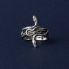 A side profile shot reveals the elegant silhouette of the snake as it wraps around the ring. The sleek lines and balanced proportions demonstrate how this ring combines gothic charm with timeless elegance. Its distinctive shape is a true statement, perfect for both men and women who appreciate bold jewelry.