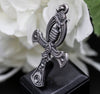 A side view of the Ankh pendant shows the detailed relief and textured surface of the sterling silver. The pendant’s unique oxidized finish creates an antique, bold look that stands out in any jewelry collection. This view also emphasizes the pendant’s craftsmanship and its appeal as a statement piece for anyone interested in ancient Egyptian motifs.