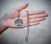 See the pendant’s size in comparison to the hand. With a diameter of 3.5 cm, this piece is substantial without being overpowering. The ideal size for both men and women, it complements any outfit while making a spiritual statement. A versatile gift for someone special in your life.
