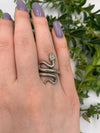 This unique handmade snake ring is crafted from 925 sterling silver, perfect for special occasions or daily wear. The serpent design, symbolic of wisdom and transformation, adds an air of mystery and elegance. Adjustable to fit most sizes, it’s ideal for men and women.