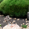 This image displays the ring on a hand, showcasing its bold and elegant design. With its gothic appeal and symbolic elements, this double snake ring suits both men and women who appreciate distinctive accessories. The ring’s non-adjustable fit and striking red stone make it a timeless piece suitable for any occasion.